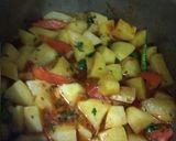 A picture of step 4 of Alu Anday gravy.