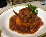 A picture of step 5 of Stuffed Bell Peppers with Tomato Sauce.