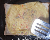 A picture of step 4 of Egg in Bread Toast.