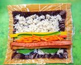 A picture of step 6 of Kimbap (Korean seaweed rice rolls).