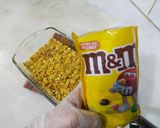 A picture of step 4 of Pineapple delight with m&m bunties.