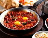 Φωτογραφία βήματος 22 της συνταγής Shakshuka. Αυγά σε σάλτσα ντομάτας