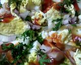 A picture of step 1 of Boiled eggs with scumble eggs with all Masala.