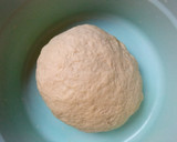 A picture of step 2 of Roti serve with curry soup.