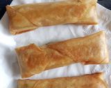 A picture of step 8 of Moong Dal Halwa Cigars dipped in Shaahi Rabdi.