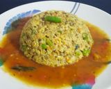 A picture of step 1 of Daliya khichdi with tomato rasam.