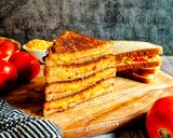 A picture of step 3 of Cheese and Tomato Grilled Sandwich.