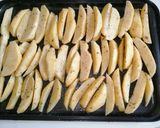 A picture of step 2 of Baked potato wedges.