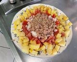 Une image de l'étape 10 de Salade de pommes de terre, tomates et oignon doux à l’ail frais et thon mariné.