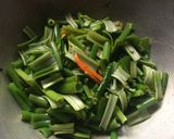 A picture of step 2 of Onion Flower Stalks dry Curry.