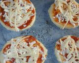 A picture of step 2 of Mini pizza with speghetti.