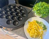 A picture of step 2 of Thai Coconut Rice Pancakes (Khanom Krok) in a Takoyaki Pan – Blender Recipe.
