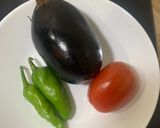 A picture of step 1 of Baingan ka bharta (with roasting method).