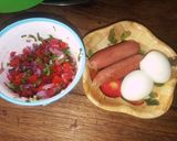 A picture of step 3 of Eggs, smokies with kachumbari.