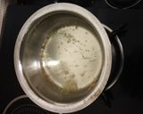 A picture of step 1 of Dhaba ginger elaichi tea.