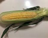 A picture of step 1 of Butter Soy Sauce Corn Rice.