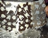 A picture of step 7 of Polka Dot Chocolate Icing cake.
