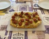 Foto del passaggio 8 della ricetta Pinsa gourmet chips di patate e pomodorini caramellati
