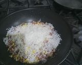 A picture of step 2 of Sweet con and hot dog fry rice.