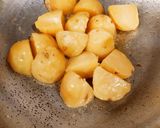 A picture of step 4 of White gravy kashmiri Aloo Dum.
