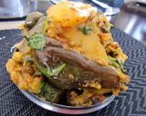 A picture of step 5 of Stuffed brinjals and potato curry in pressure cooker.
