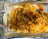 A picture of step 10 of Biryani with colourful salad.