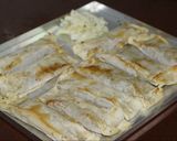 A picture of step 3 of Baked Veggie spring Rolls in Red Sauce.