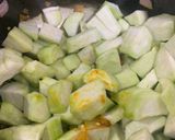 A picture of step 4 of Turaii (Ridge gourd) with kalonji and curry leaf.