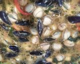 Foto del paso 7 de la receta Arroz caldoso de berberechos y mejillones