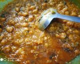 A picture of step 2 of Masala poori with white chana.