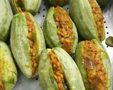 A picture of step 4 of Potoler dolma pointed gourd with spicy filling.