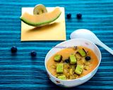A picture of step 4 of Muskmelon soup topped with green tea cake croutons.