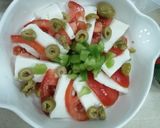 A picture of step 2 of Haloumie cheese with tomato.