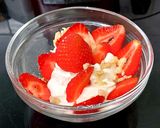 A picture of step 4 of My Healthy Dessert. Greek yogurt & Sliced fresh 🍓+ Nuts.