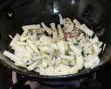 A picture of step 3 of Runner beans and potato fry with onion and onion greens.