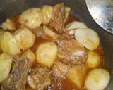 A picture of step 8 of Chicken qorma aloo.