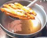 A picture of step 5 of Fried snake guard.