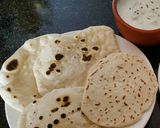 A picture of step 7 of Pita bread on the pan with sourdough starter.