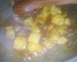 A picture of step 6 of Alu Palak.