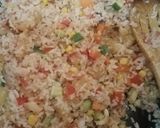 A picture of step 12 of Thai style fried rice with pineapple.
