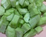 A picture of step 1 of Turaii (Ridge gourd) with kalonji and curry leaf.