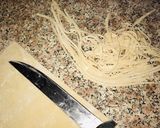 A picture of step 8 of Homemade egg pasta with shredded chicken sauce.