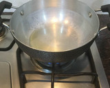 A picture of step 2 of Chilli and grapes Pickle.