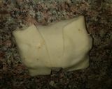 A picture of step 4 of Chicken cheese packet roll.