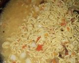 A picture of step 4 of Indomie with potato and dried fish.