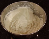 A picture of step 16 of White Layer Cake with a Raspberry Swirl Cheesecake center layer and a Raspberry Cream Frosting.