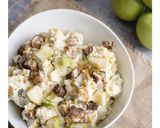 A picture of step 4 of Caramel Apple Snickers Salad.