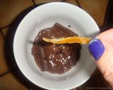A picture of step 9 of Orange peels- dates and raisins chocolate candy.
