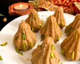 A picture of step 6 of Nolen Gurer Millet Oats Modak.