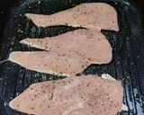 A picture of step 1 of Grilled Chicken Breast w/ Garlic & Parsley.